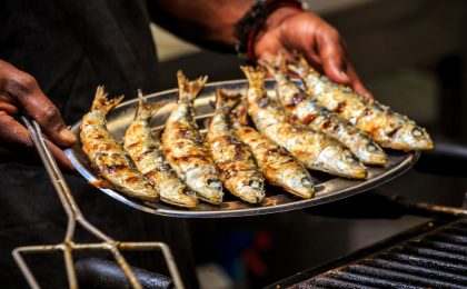 Freshly grilled sardines on silver plate, Portugal