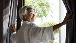 Gray Haired woman at window