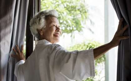 Gray Haired woman at window