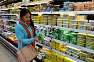 Woman reading labels in store