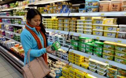 Woman reading labels in store