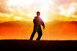 Man practicing tai chi at sunset