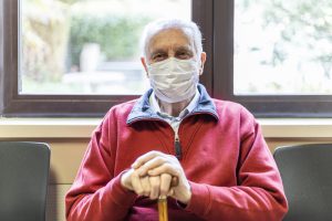 elderly man in a hospital with respirator