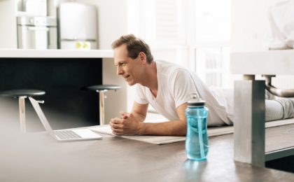 Man working out w/ laptop