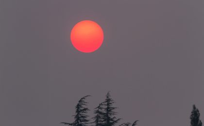 red sun dull grey skies