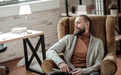 Tired psychologist having a little nap after hard-working day