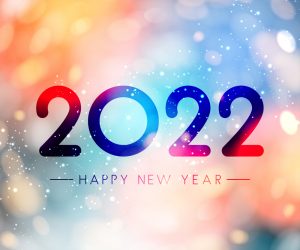 Fogged glass 2022 sign on colorful bokeh background.